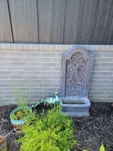 Fountain with peacock and flower pot