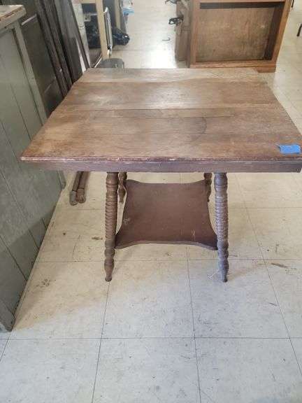 Vintage wooden side table top is cracked in wood