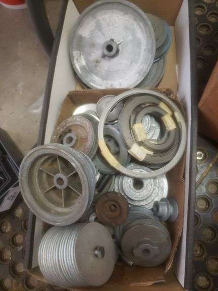 Box Of Pulleys And Metal Measuring Tape