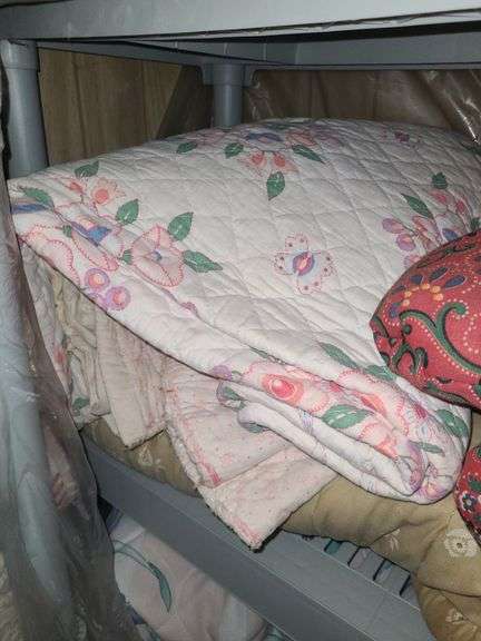 Assorted Blankets And Plastic Shelving Unit