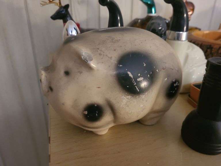 Cologne Bottles, Piggy Bank, And Knife