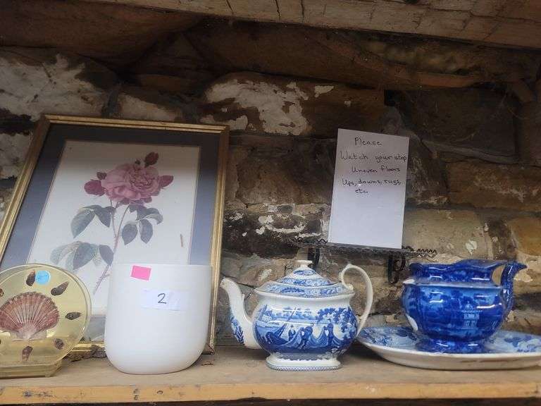 Shelf With Pictures, Tea Pots, Shell Decor
