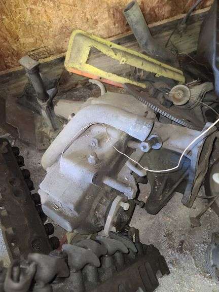 Small Block Chevy Heads, FWD Dodge Transmission and Assorted Engine and Car Parts, Under Workbench