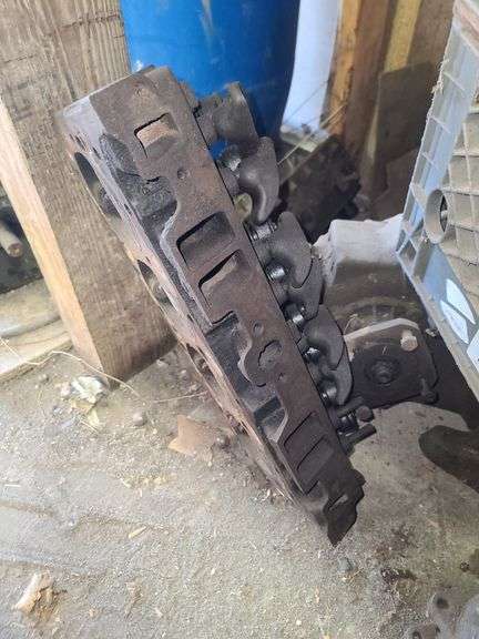 Small Block Chevy Heads, FWD Dodge Transmission and Assorted Engine and Car Parts, Under Workbench