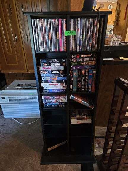 Movie Stand W/ DVD'S & VHS Movies Approx 19" x 7" x 51" Tall