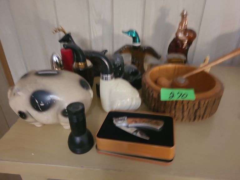 Cologne Bottles, Piggy Bank, And Knife