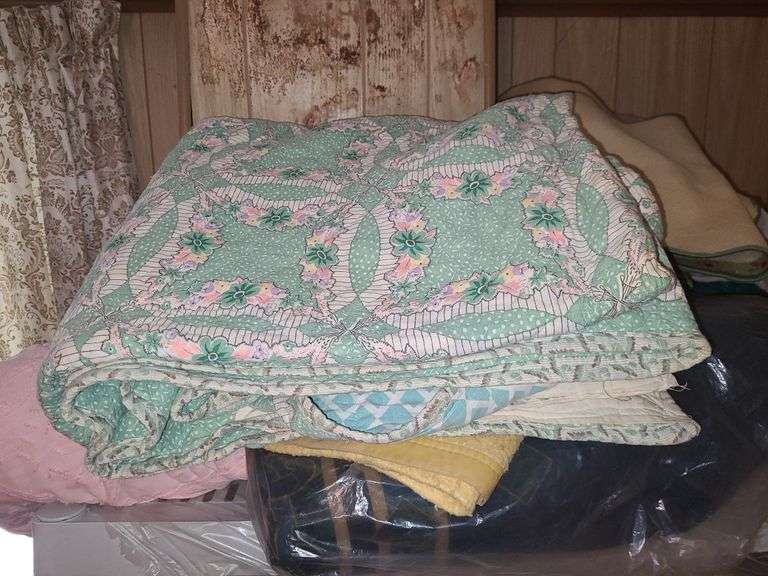 Assorted Blankets And Plastic Shelving Unit