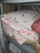 Assorted Blankets And Plastic Shelving Unit