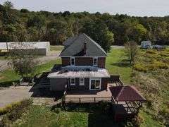 Parcel #2: Brick Home & Outbuildings on 94± Acres
