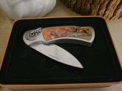 Cologne Bottles, Piggy Bank, And Knife