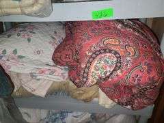 Assorted Blankets And Plastic Shelving Unit