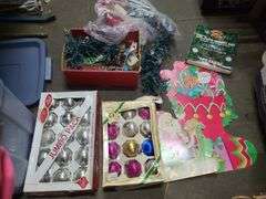 Box Of Christmas Decor, Paper Decorations, Cookie Jar, Lights, And Tree Toppers