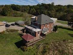 Parcel #2: Brick Home & Outbuildings on 94± Acres