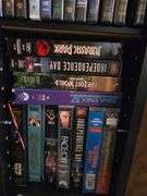 Movie Stand W/ DVD'S & VHS Movies Approx 19" x 7" x 51" Tall