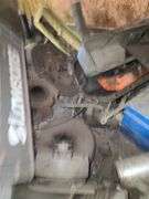 Small Block Chevy Heads, FWD Dodge Transmission and Assorted Engine and Car Parts, Under Workbench