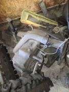 Small Block Chevy Heads, FWD Dodge Transmission and Assorted Engine and Car Parts, Under Workbench