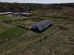 Parcel #2: Brick Home & Outbuildings on 94± Acres