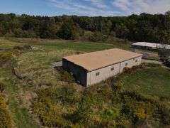 Parcel #2: Brick Home & Outbuildings on 94± Acres