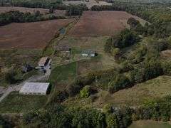 Parcel #2: Brick Home & Outbuildings on 94± Acres