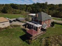 Parcel #2: Brick Home & Outbuildings on 94± Acres