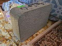 Suitcase And Crocheted Hot Pads