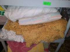 Assorted Blankets And Plastic Shelving Unit