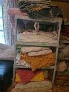 Assorted Blankets And Plastic Shelving Unit