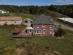 Parcel #2: Brick Home & Outbuildings on 94± Acres