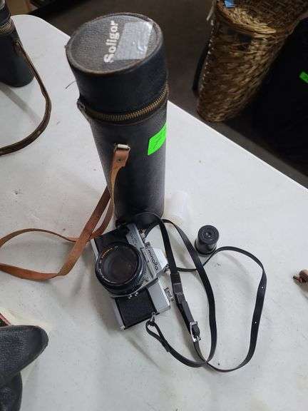 Minolta SrT101 35mm Camera and Soligor Telephoto Lens with Case