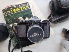 Pentax 35mm Camera, with Case, Empty Lens Case, Magazine, and Manual