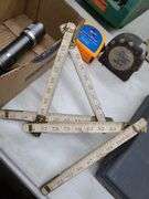 Two Tape Measures, One Folding Stick Measure, and Flashlight