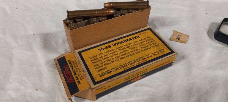 16 rnds 38-55 Win & 3 empty brass
