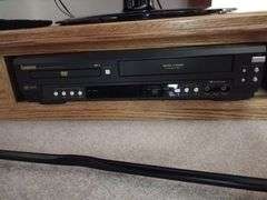 42" LG TV, Oak Floor Stand Approx 33"x8"x19", Symphonic DVD, VHS Player - Works
