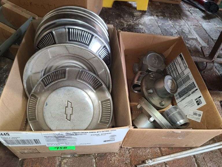 Two Boxes of Chevy Hubcaps and Center Caps - Baer Auctioneers - Realty, LLC