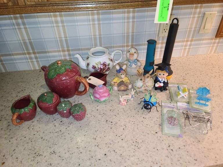 Contents of Countertop: Strawberry Tea Set(Some Chipping), Bunny, Bug and Mini Accents Decor, Two Flashlights, Other Teapot(No Lid, Creamer and Avon