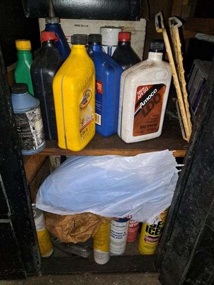 Contents Of Lower Cabinets, Partial Bottles Of Oil, Glass Jars, And De-Icer