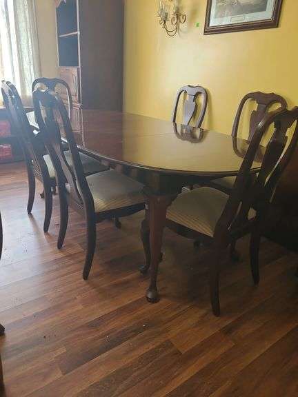 Table, 3 leaves. Includes 1 capatins chair & 5 dining chairs
