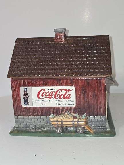 Coca-Cola barn-shaped ceramic cookie jar.