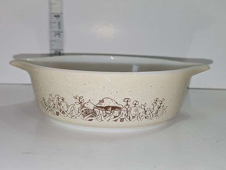 Vintage PYREX casserole dish in the "Forest Fancies" pattern.