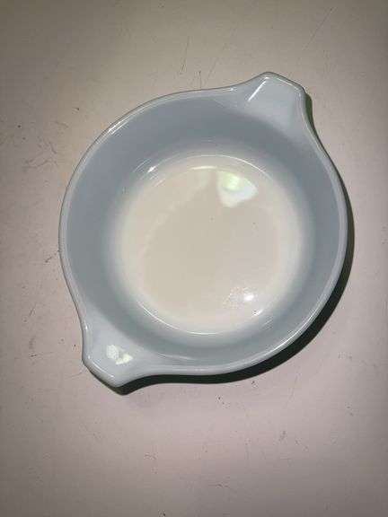 Vintage Pyrex Amish Butterprint turquoise with white design casserole dish with a lid.