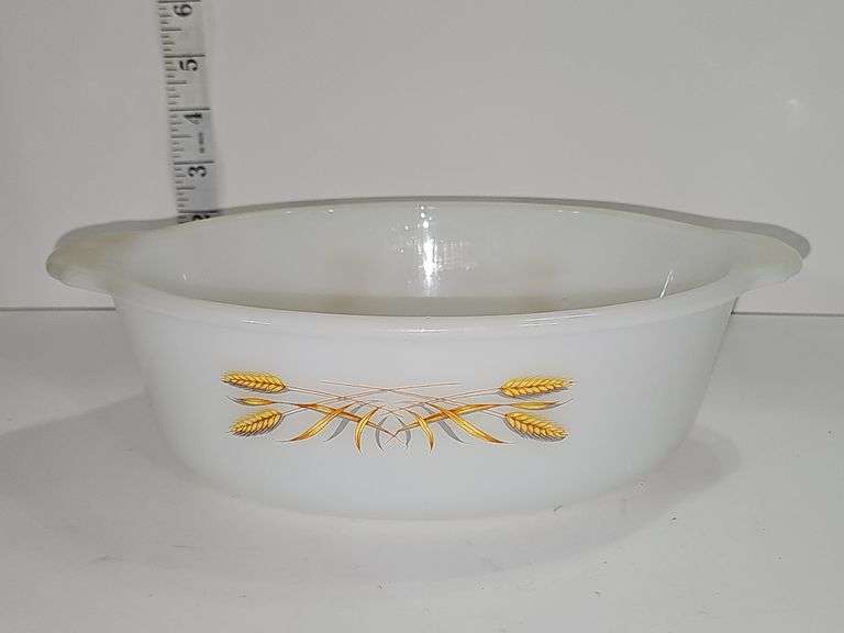 Fire-King casserole dish with the "Golden Wheat" pattern.
