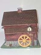 Coca-Cola barn-shaped ceramic cookie jar.