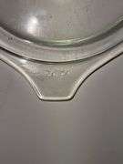 Vintage Pyrex Amish Butterprint turquoise with white design casserole dish with a lid.