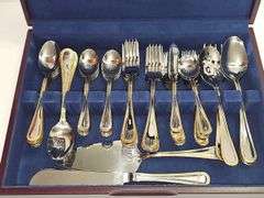 Stainless Steel flatware in wooden storage box