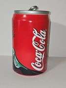 Vintage Coca-Cola can-shaped ceramic cookie jar.