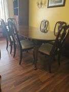 Table, 3 leaves. Includes 1 capatins chair & 5 dining chairs