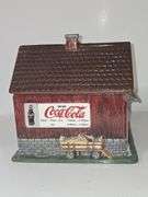 Coca-Cola barn-shaped ceramic cookie jar.