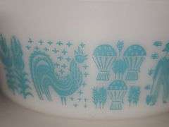 Vintage PYREX Amish "Butterprint" white with turquoise casserole dish with a lid.