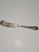 Silver colored cup and flatware