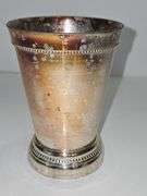 Silver colored cup and flatware